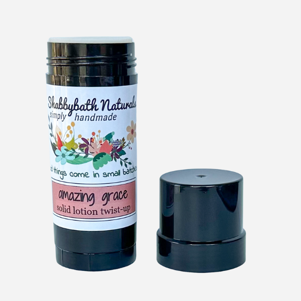 Shabbybath Naturals solid lotion twist-up with floral label on a white background